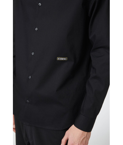 G071 - 6211 - 9000
  Iceberg
   Noir
  Chemise
  Tissu principal: 100% Cotton
. Coupe : regular                . Coupe :